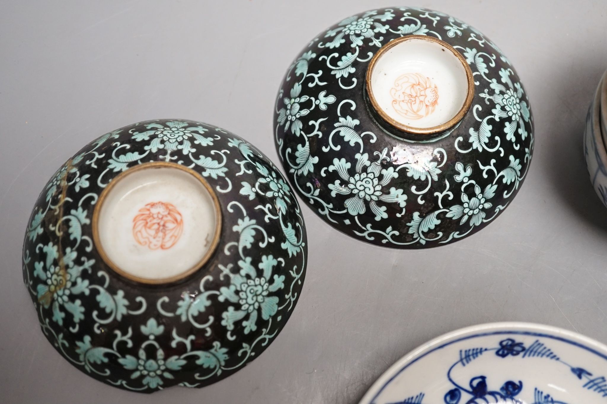 A 19th century Chinese black ground porcelain bowls and two covers, together with an three onion pattern blue and white tea bowls and saucers a/f